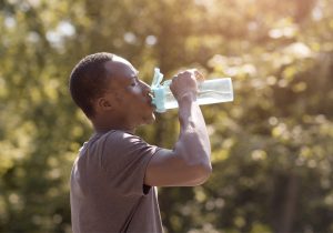 A man drinks some water
