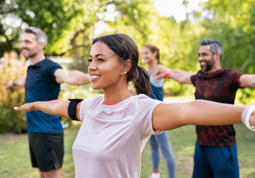 A group does yoga in the park