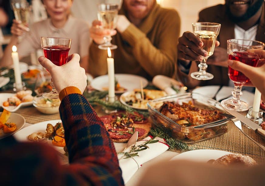 a family eats thanksgiving dinner