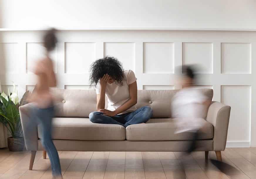 a woman is stressed out on her couch