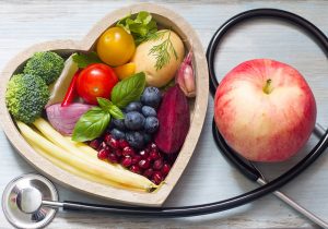 fruit is in a heart shaped bowl